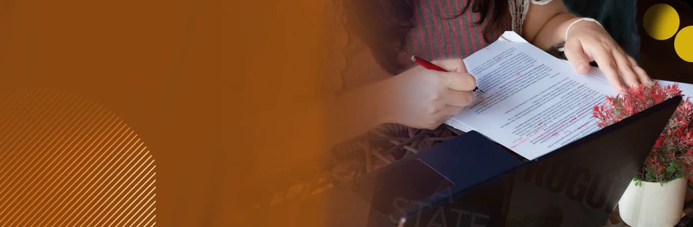 Proofreader marking up a manuscript with a red pen